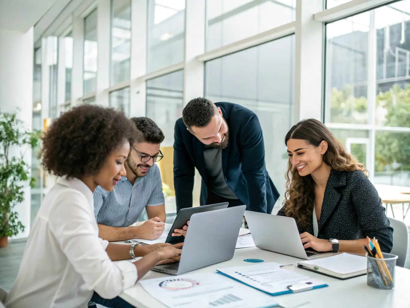 A professional executive is participating in a skills assessment workshop, surrounded by colleagues and facilitators, in a modern office setting. The atmosphere is collaborative and focused on individual development.